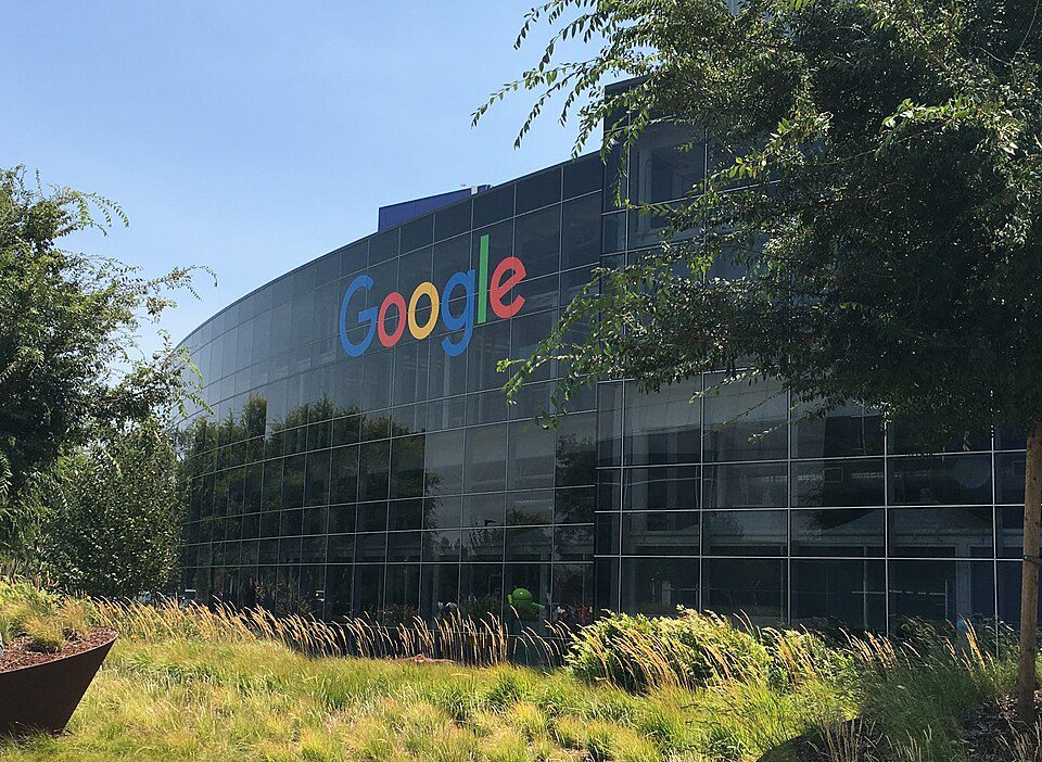 Google and Meta logos split across European Union flag, AI regulation concep