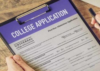 College admissions officer using AI detection tools to review a student’s application essay on a computer