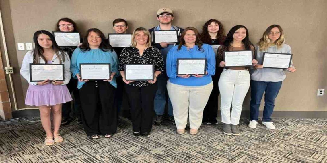 A college student using a laptop while AI detection tools run in the background, highlighting confusion over digital writing boundaries.