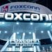 Foxconn AI server production line with workers assembling high-performance computing equipment for global distribution.