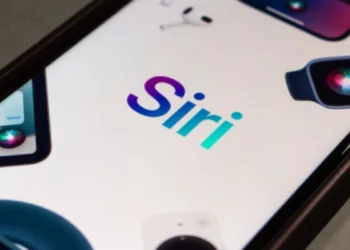 iPhone using the new Siri powered by Apple Intelligence for hands-free control.