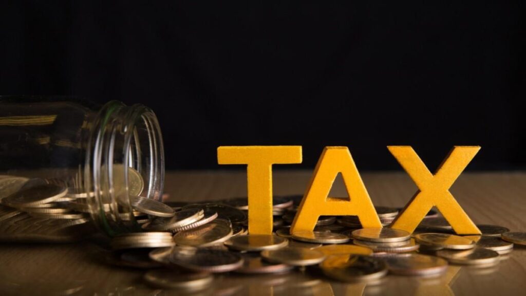 A taxpayer reviews U.S. tax forms after realizing a relocation oversight left IRS dues unpaid.
